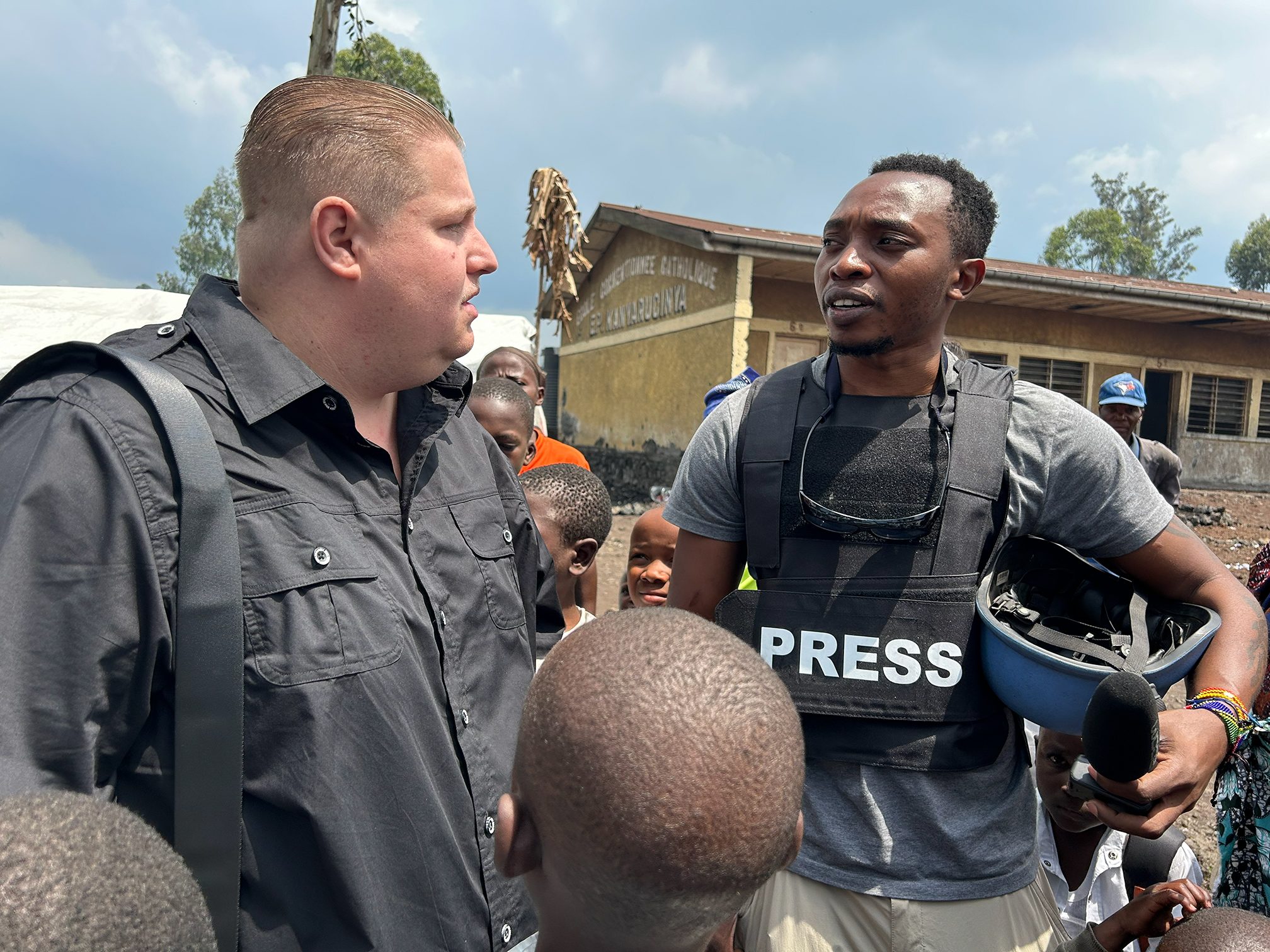 Alexander Carrigg and Guylain Balume Muhindo at Kanyaruchinya camp